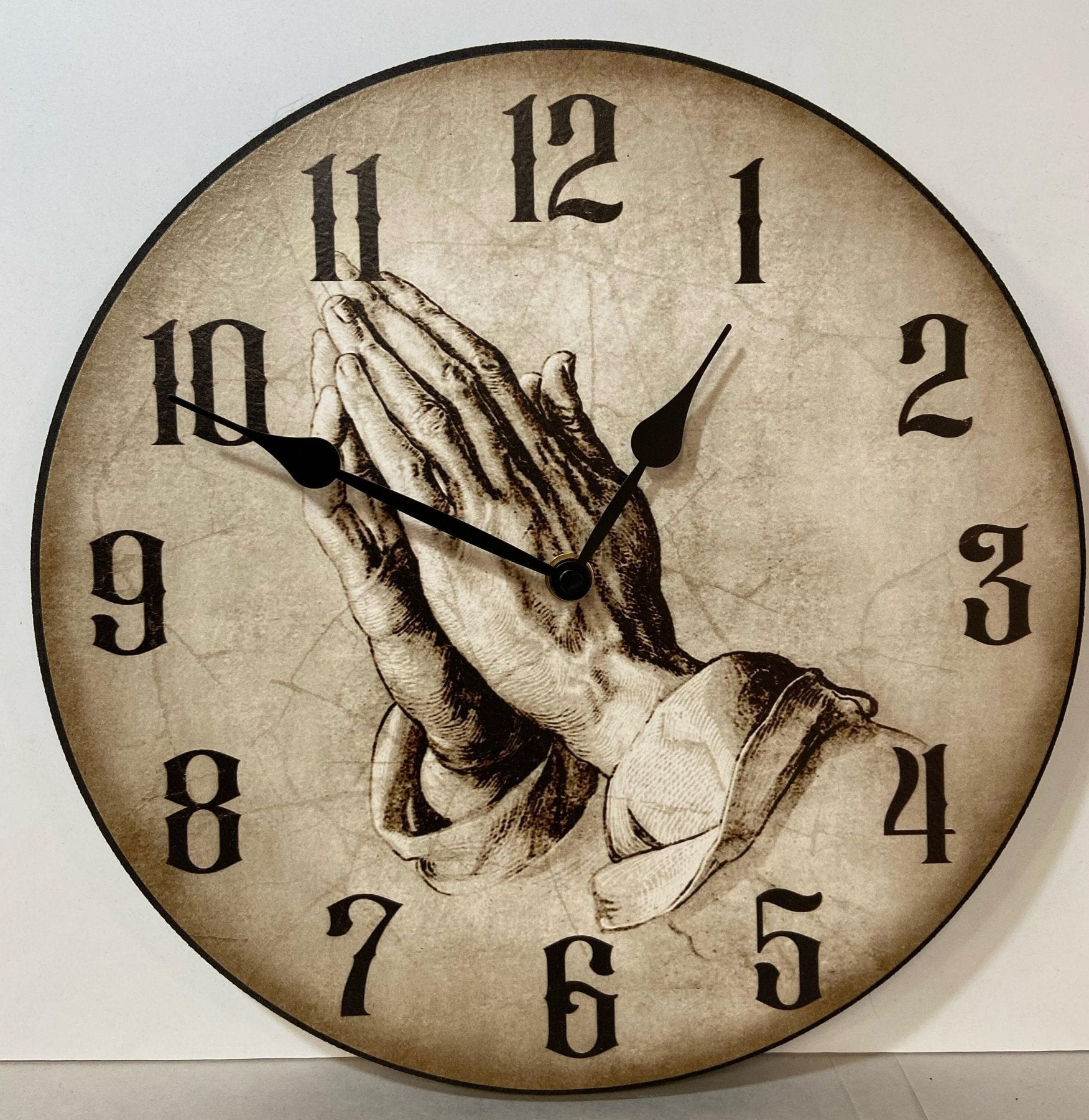 il_fullxfull.5796649515_slxo.jpg Parchment Praying Hands Wall Clock - Image 1